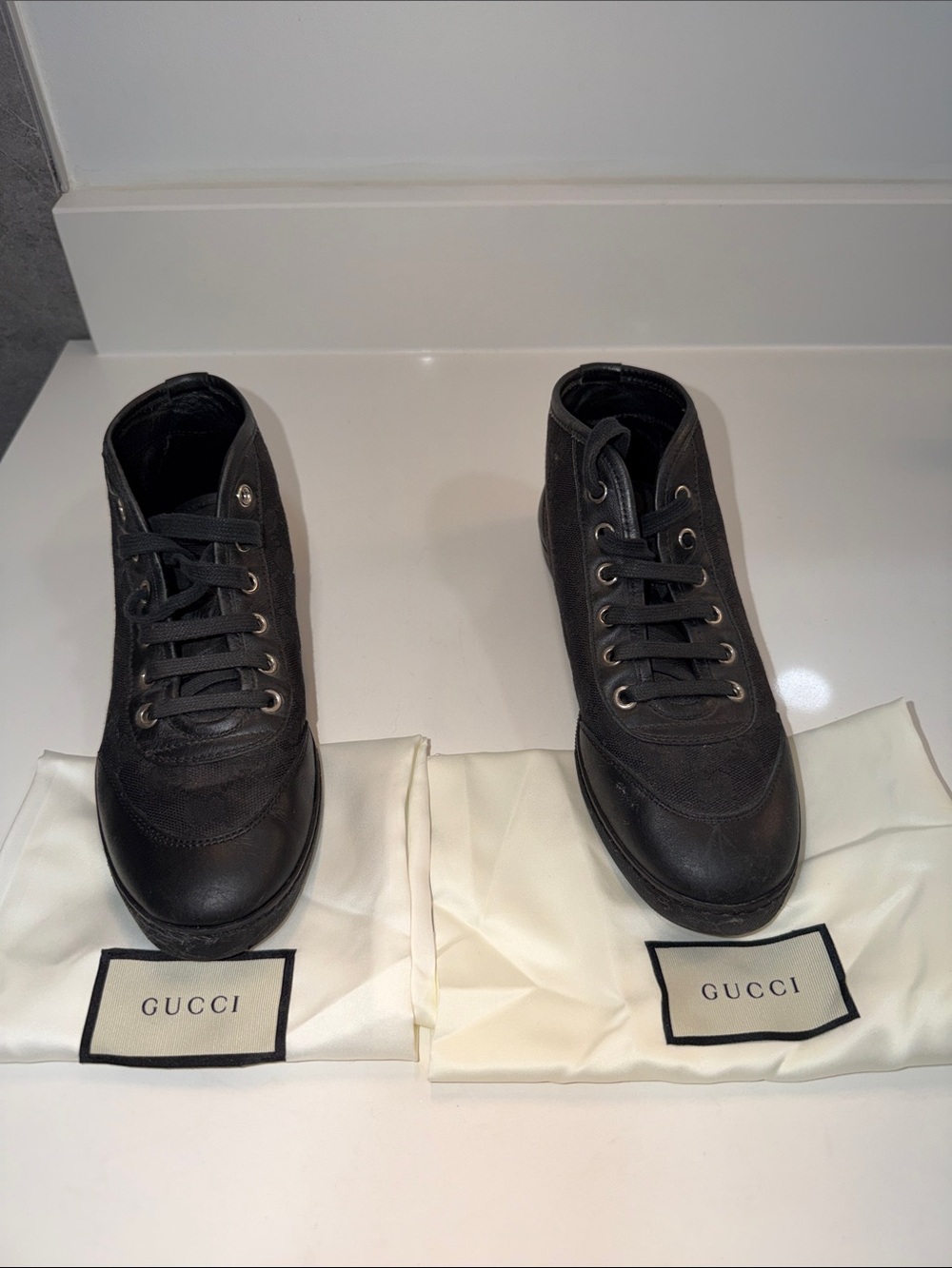 Gucci women’s Black High-Top Canvas & Leather Sneakers